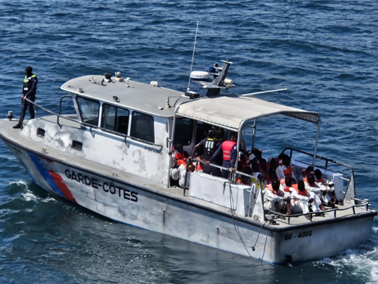 The crew of U.S. Coast Guard Cutter Venturous (WMEC 625) conducts a repatriation of 65 Haitian migrants to the Haitian coast guard, anchored in Cap-Haïtien, Haiti, March 12, 2024. Venturous patrolled the South Florida Straits and Windward Passage within the Coast Guard Seventh District’s area of responsibility to conduct maritime safety and security missions while working to detect, deter, and intercept unsafe and unlawful migrant ventures bound for the United States.
