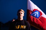 U.S. Army Cpt. Tyler Davis, Army North law enforcement intelligence cell officer, poses for a photo after winning the plank competition during Army North (Fifth Army) Friday physical training at Joint Base San Antonio-Fort Sam Houston, Texas, on March 22, 2024. Command  PT helps to build camaraderie and es spirit de corps among the unit. (U.S. Army photo by Sgt. Andrea Kent)