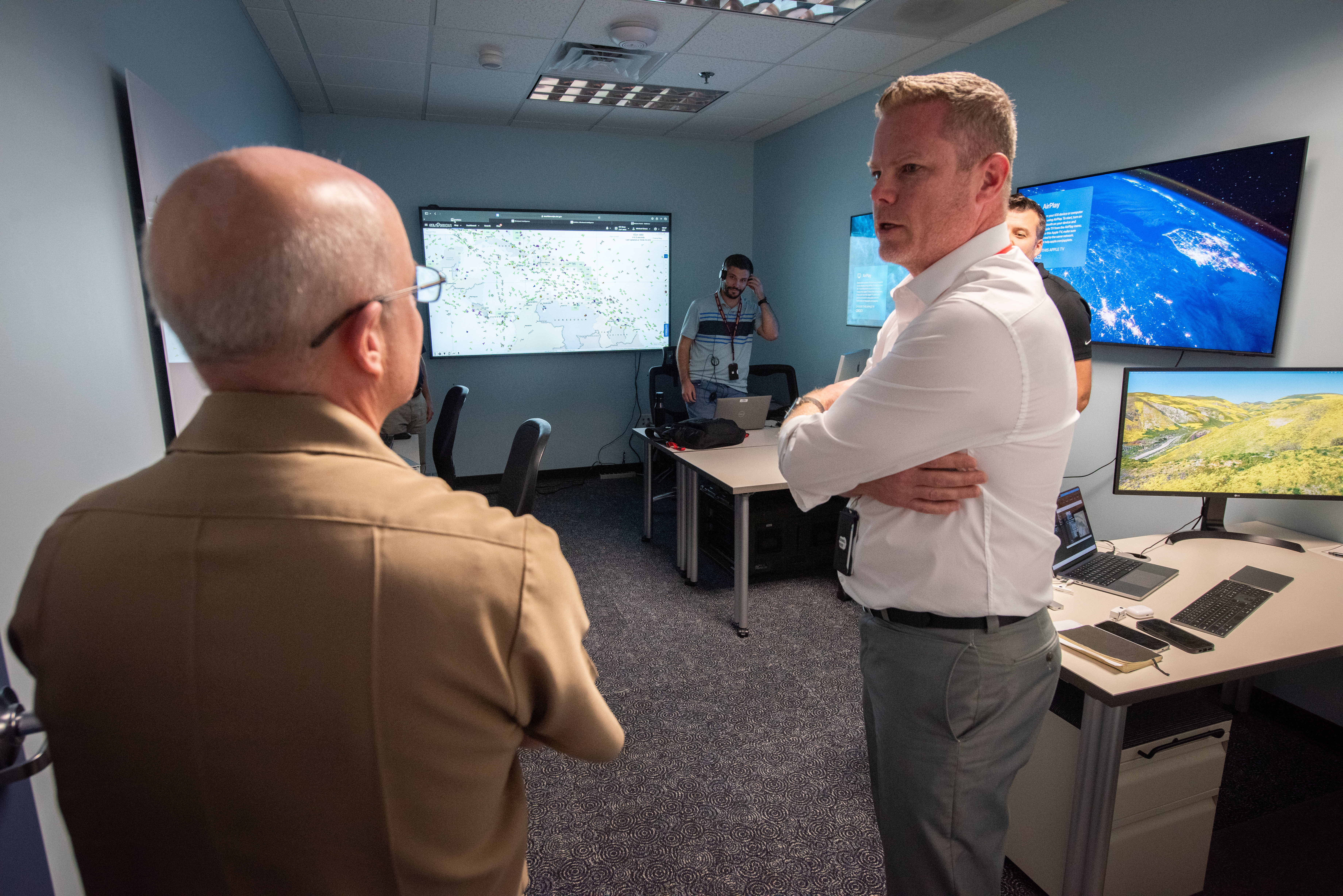 Chief of Naval Research Rear Adm. Kurt Rothenhaus receives briefings at Naval Information Warfare Center Atlantic on March 21 from members of the Expeditionary Warfare Department and the Science and Technology Department during the command’s annual System of Systems Naval Integration Experiment.