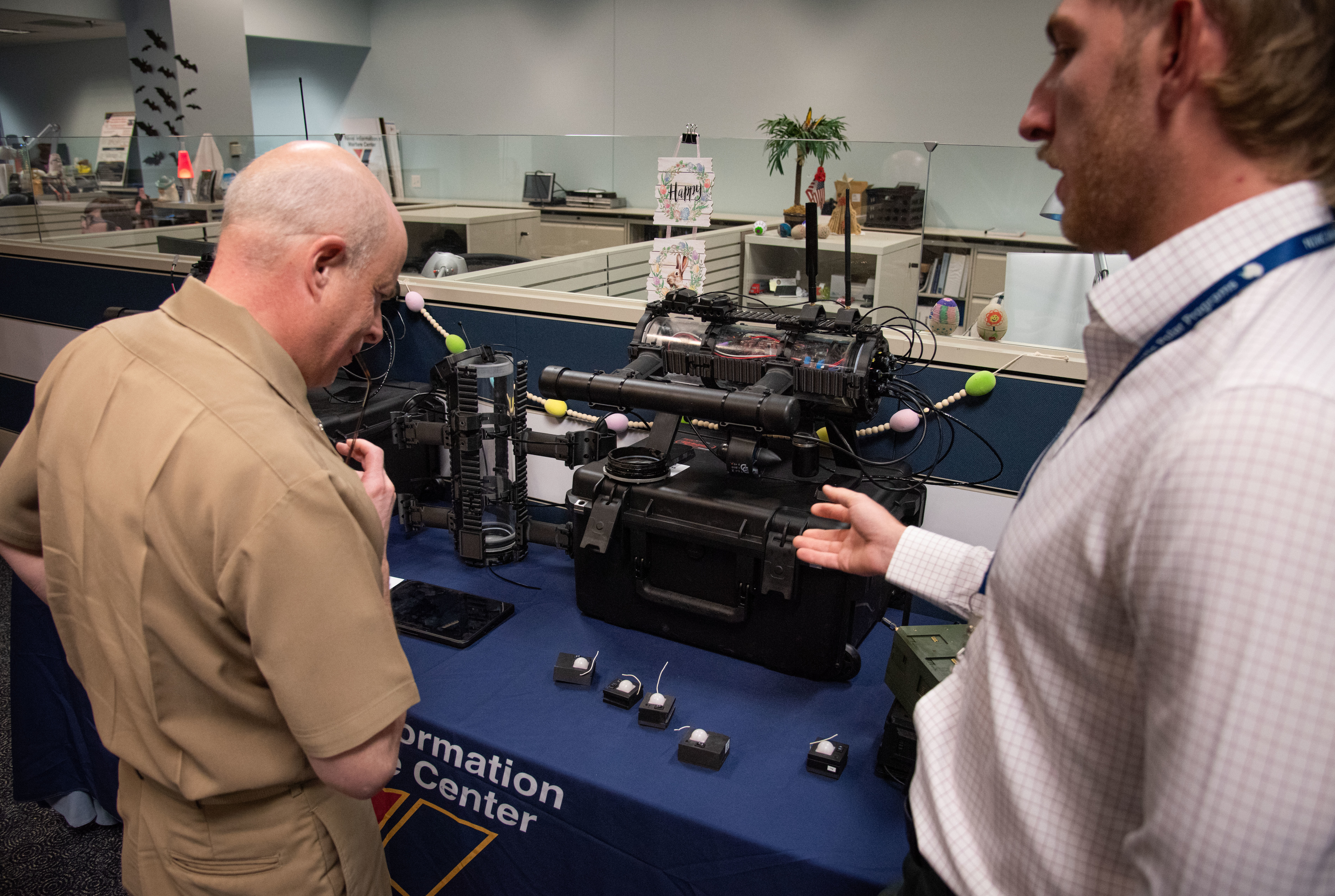 Chief of Naval Research Rear Adm. Kurt Rothenhaus receives briefings at Naval Information Warfare Center Atlantic on March 21 from members of the Expeditionary Warfare Department and the Science and Technology Department during the command’s annual System of Systems Naval Integration Experiment.