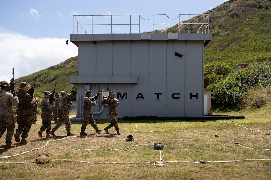 U.S. Marines with 3d Littoral Combat Team, 3d Marine Littoral Regiment, 3d Marine Division rehearse clearing in a taped house layout on Marine Corps Base Hawaii, March 19, 2024. The structure is a Modular Armored Tactical Combat House, used to improve close quarter skills by simulating various scenarios with realistic and ballistically safe environment. (U.S. Marine Corps photo by Sgt. Jacqueline C. Parsons)