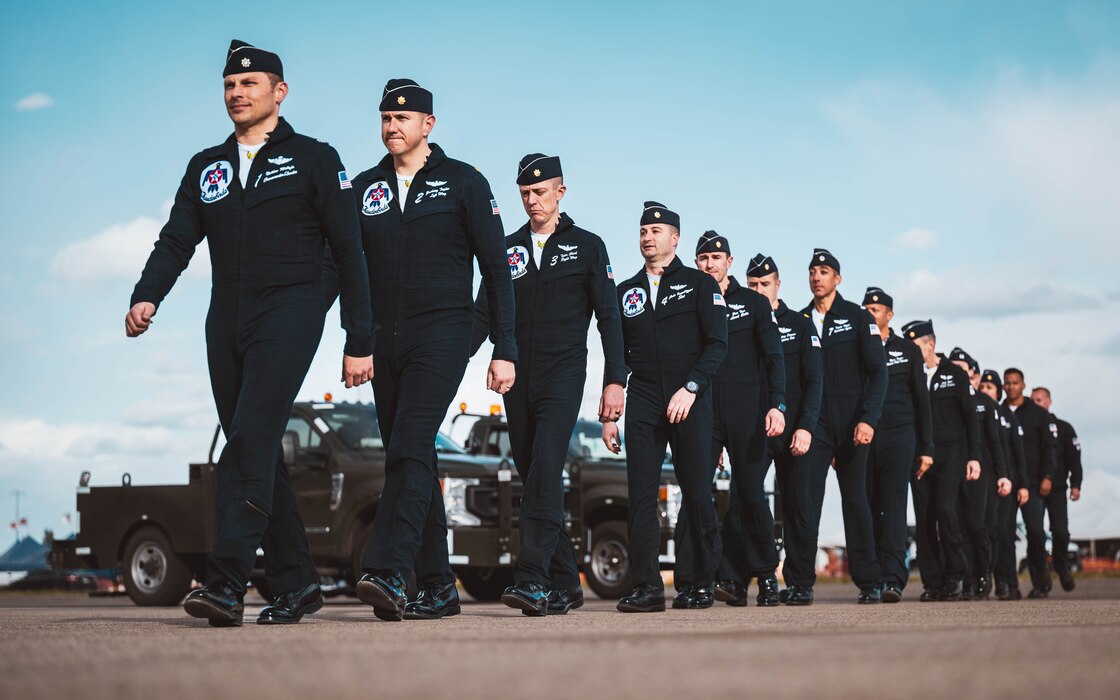 U.S. Air Force officers assigned to the U.S. Air Force Demonstration team, the "Thunderbirds," march in sync following their final performance at the Luke Days 2024 Airshow.