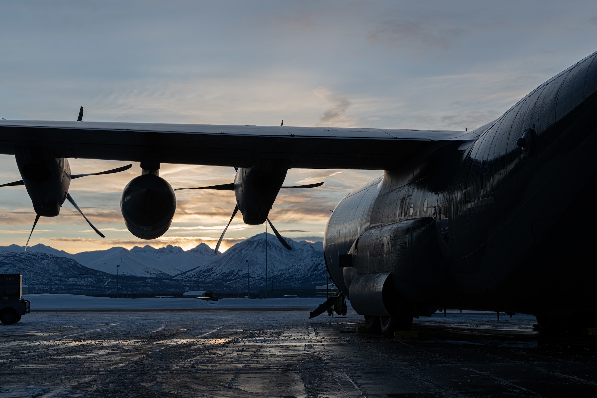 An MC-130J Commando II assigned to the 27th Special Operations Wing is parked on the flightline during Arctic Edge 24 in Anchorage, Alaska, Feb. 27, 2024. AE24 is an annual defense exercise for the U.S. Northern Command emphasizing Joint Force operations in an extreme cold weather and high latitude environment and is designed to demonstrate Globally Integrated Layered Defense in the Arctic. (U.S. Air Force photo by Senior Airman Drew Cyburt)