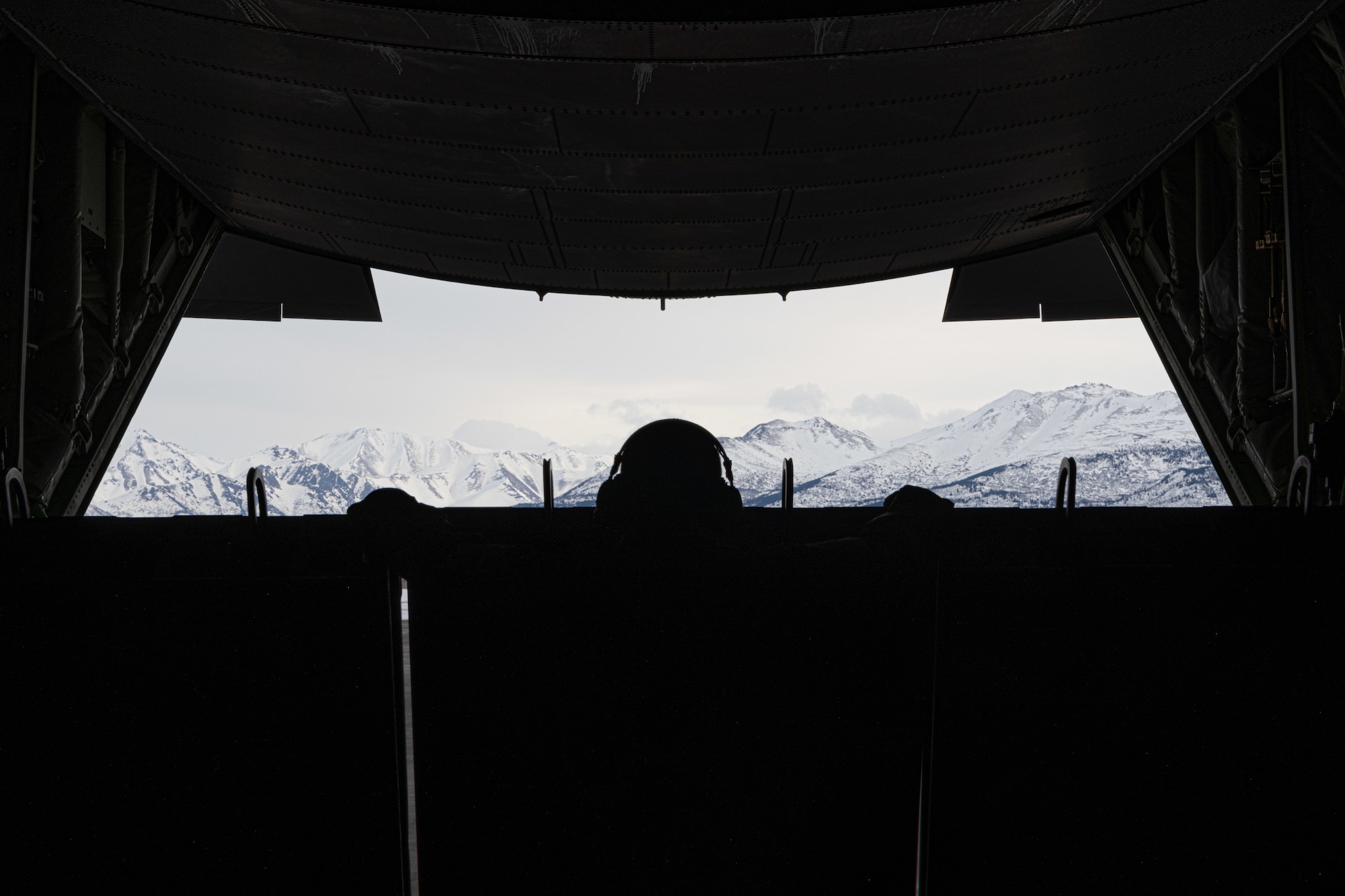 A U.S. Air Force Airman assigned to the 27th Special Operations Wing looks out the back of an MC-130J Commando II while taxiing during Arctic Edge 24 in Anchorage, Alaska, Feb. 21, 2024. Arctic Edge is an annual defense exercise designed to demonstrate that our forces are engaged, postured, and ready to assure, deter, and defend the U.S. and Canada in an increasingly complex Arctic security environment. (U.S. Air Force photo by Senior Airman Drew Cyburt)