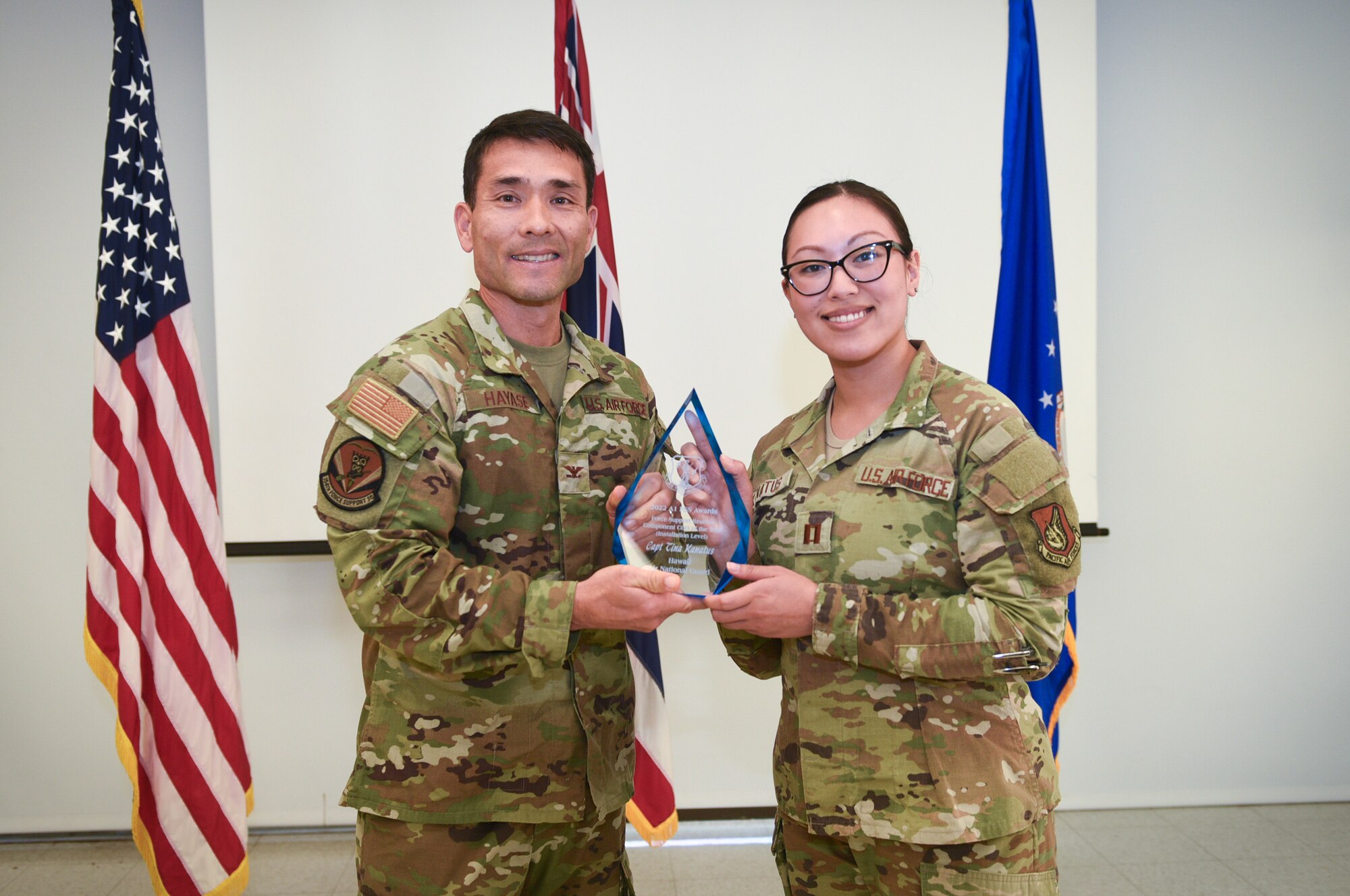 Col. Glen Hayase, 154th Mission Support Group deputy commander and 154th Force Support Squadron commander, presents the National Guard Bureau Force Support Reserve Component Company Grade Officer of the Year Award (Installation Level) to Captain Tina Kanatus March 2, 2024, at Joint Base Pearl Harbor- Hickam, Hawaii. Kanatus is the first known Guardsman to take home this national-level award for the second year running, demonstrating unparalleled leadership and adaptability for the years of 2022 and 2023. Beyond her exceptional performance in assignments within the Pacific Air Force’s Inspector General Team and her instrumental role in the administration of Talisman Sabre, her ongoing management of accountability for Joint Task Force-Red Hill stands as a testament to her enduring impact and invaluable contributions to mission success. (U.S. Air National Guard photo by Tech. Sgt. John Linzmeier)
