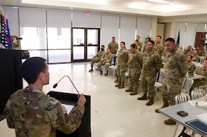 Members of the 154th Force Support Squadron Fatality Search and Recovery Team as they are announced to be the National Guard Bureau A1 Special Recognition Team (Installation Level) March 2, 2024, at Joint Base Pearl Harbor- Hickam, Hawaii. The FSRT’s rapid deployment and successful operation in the wake of the State of Hawaii’s deadliest wildfire exemplify their exceptional readiness and efficiency, conducted through the most challenging of circumstances. Covering an expansive area and delivering crucial closures to affected families, their actions highlight an unmatched level of preparedness and commitment to helping those in need. (U.S. Air National Guard photo by Tech. Sgt. John Linzmeier)