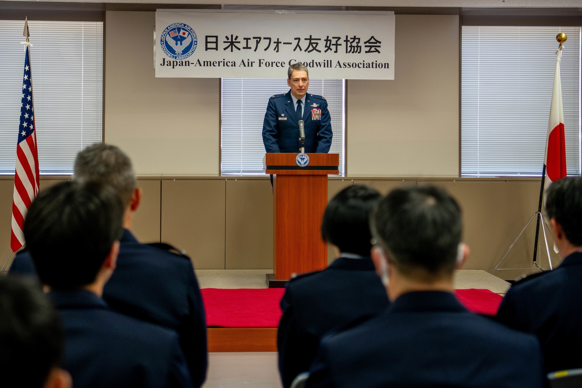 U.S. Air Force Col. Andrew Roddan, 374th Airlift Wing commander, gives remarks.