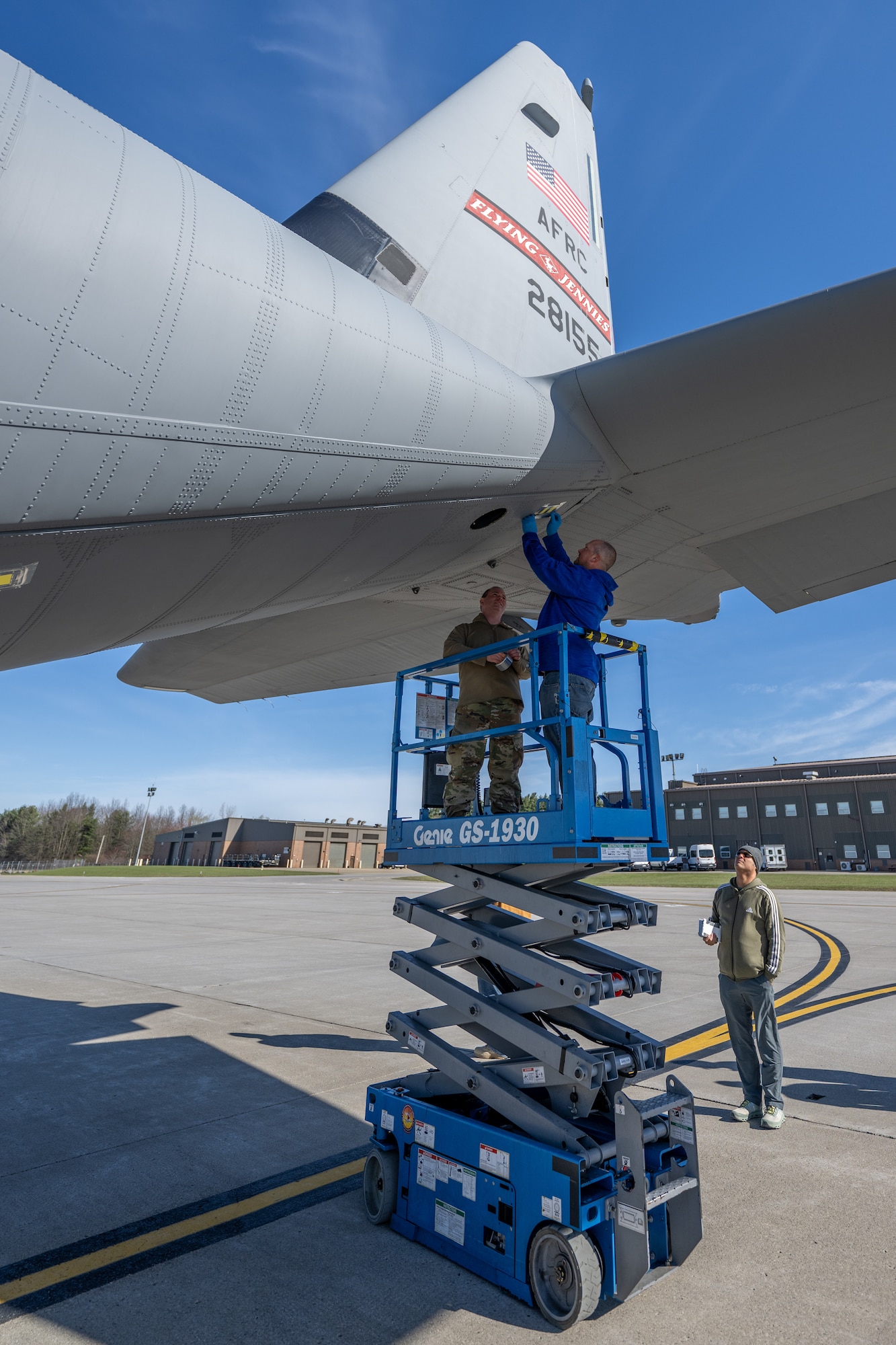 Matthew Kilmer, a C-130 system engineer from the Air Logistics Complex System Program Office, Georgia, fastens a droplet sample card to the tail of a C-130J-30 Super Hercules aircraft at Youngstown Air Reserve Station, Ohio, March 25, 2024.