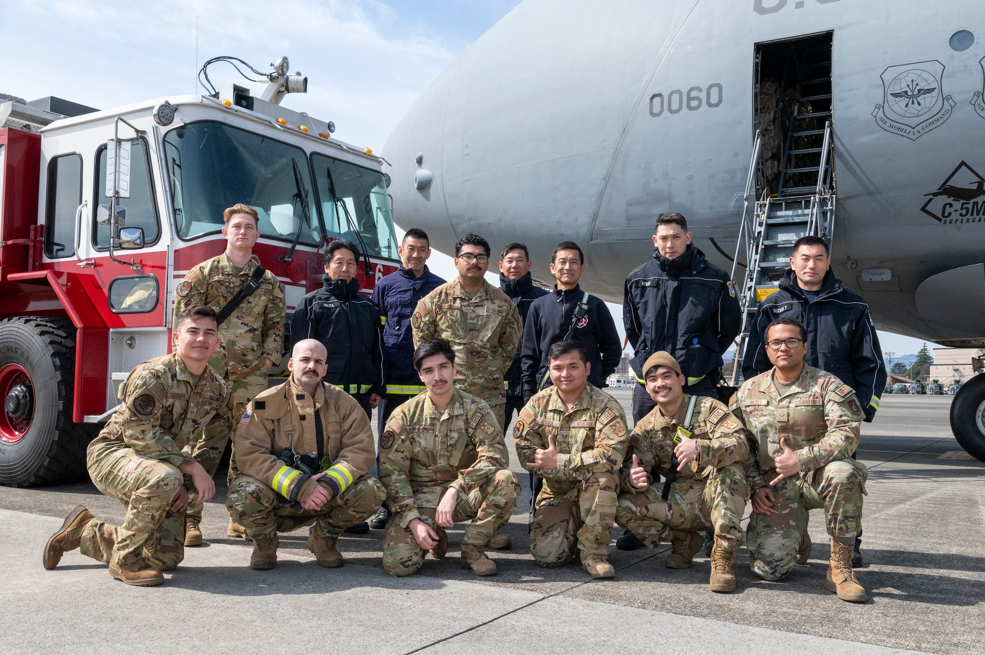 Firefighters from the 374th Civil Engineer Squadron pose for a group photo.