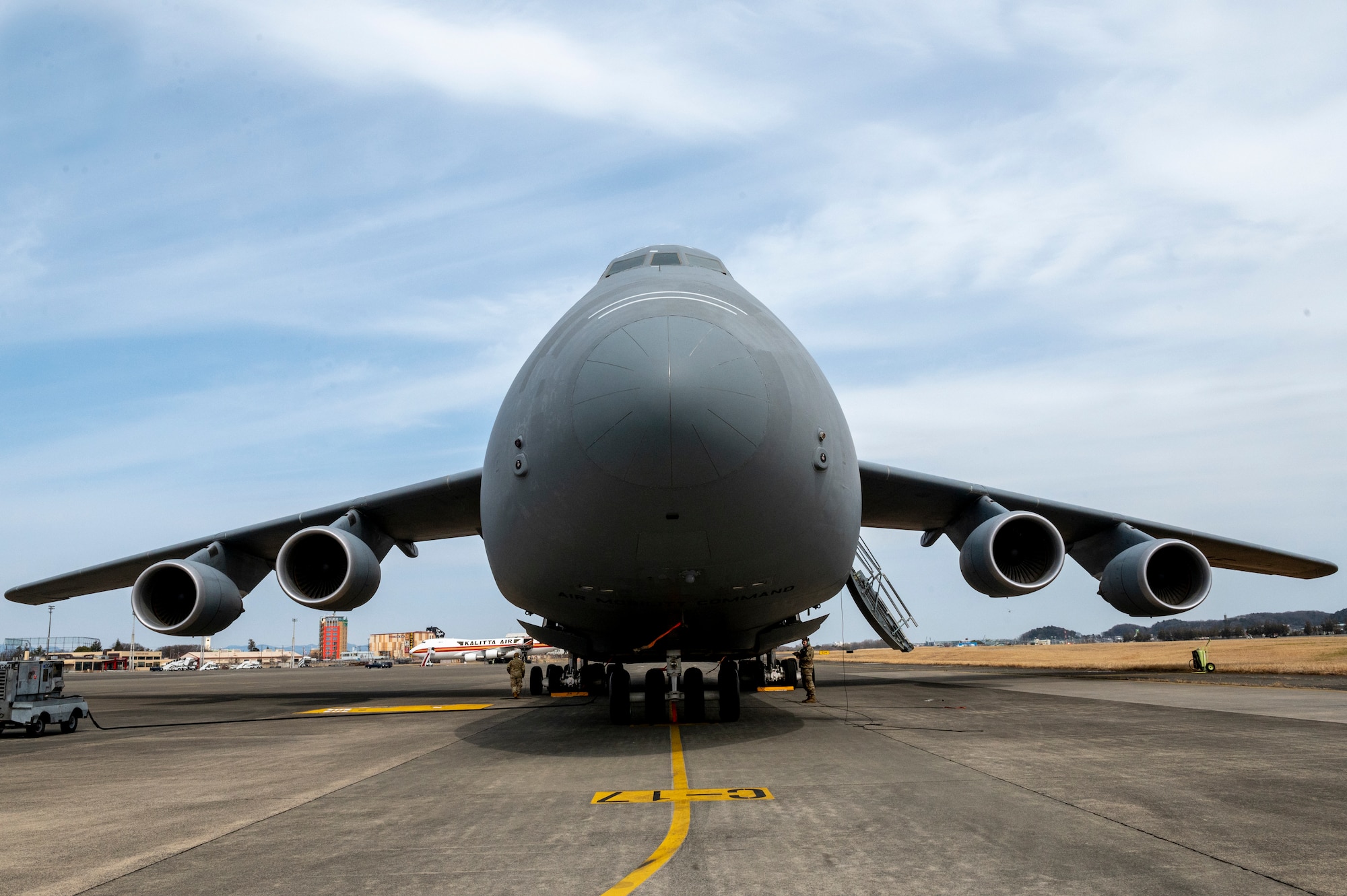 A C-5M Super Galaxy, assigned to the 60th Air Mobility Wing, Travis Air Force Base, CA, sits on the flightline at Yokota Air Base.