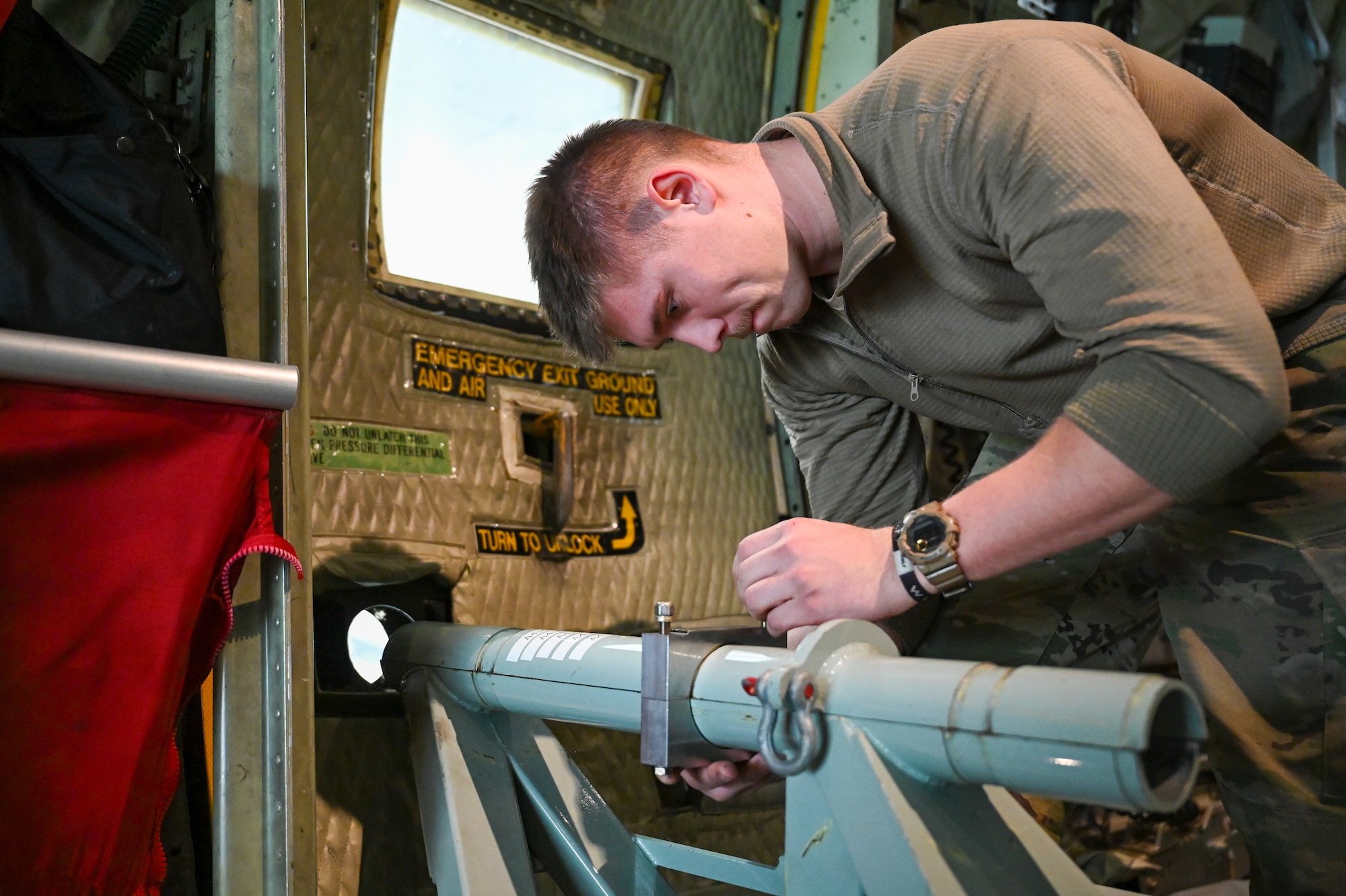 Senior Airman Dylan Miller, an aerial spray system maintainer assigned to the 910th Maintenance Squadron, caps the spray boom sleeve of the 910th Airlift Wing’s electronic modular aerial spray system on board a C-130J-30 Super Hercules aircraft from Keesler Air Force Base, Mississippi, visiting Youngstown Air Reserve Station, Ohio, March 21, 2024.