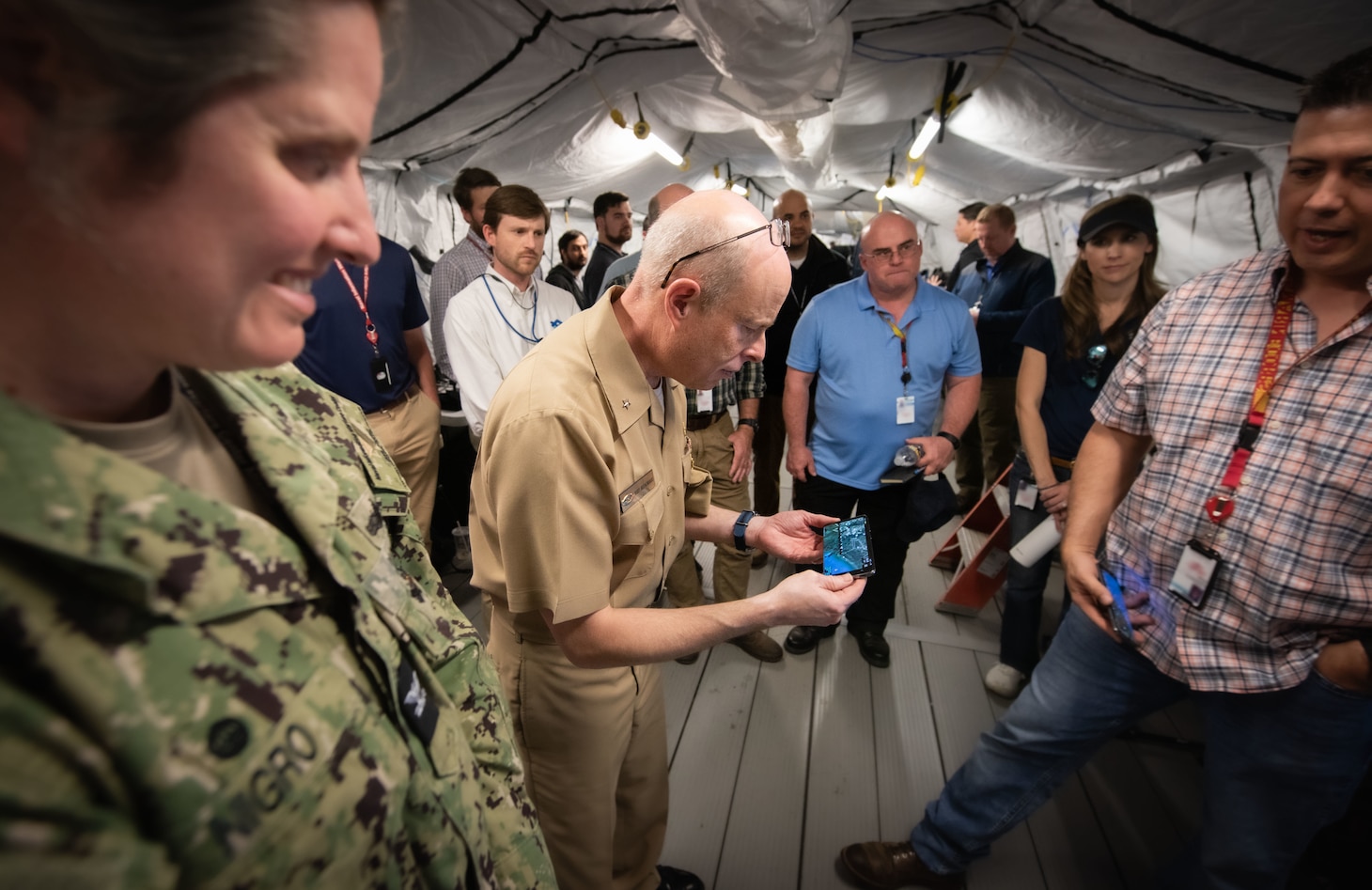 Chief of Naval Research Rear Adm. Kurt Rothenhaus receives briefings at Naval Information Warfare Center Atlantic on March 21 from members of the Expeditionary Warfare Department and the Science and Technology Department during the command’s annual System of Systems Naval Integration Experiment.