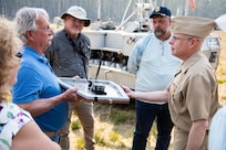 Chief of Naval Research Rear Adm. Kurt Rothenhaus receives briefings at Naval Information Warfare Center Atlantic on March 21 from members of the Expeditionary Warfare Department and the Science and Technology Department during the command’s annual System of Systems Naval Integration Experiment.