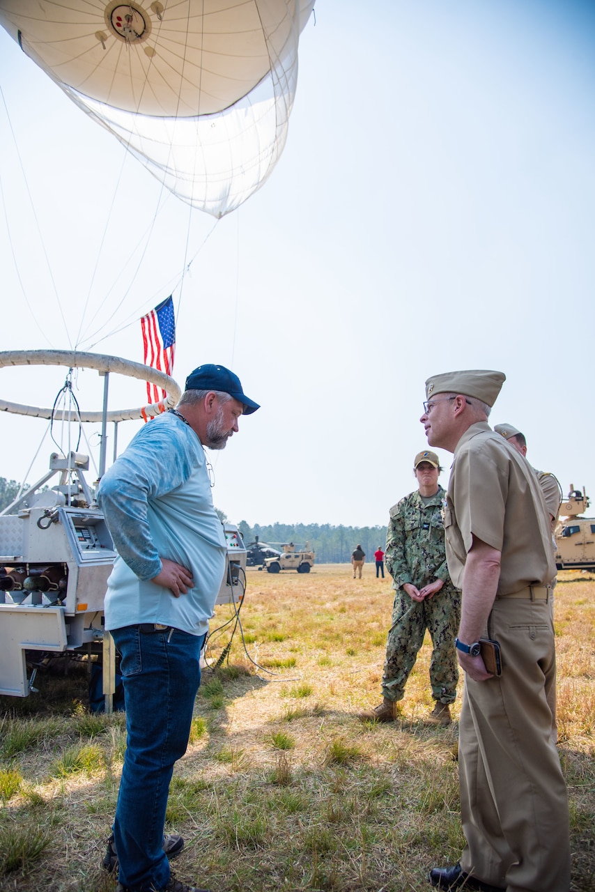 Chief of Naval Research Rear Adm. Kurt Rothenhaus receives briefings at Naval Information Warfare Center Atlantic on March 21 from members of the Expeditionary Warfare Department and the Science and Technology Department during the command’s annual System of Systems Naval Integration Experiment.