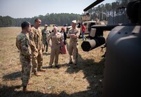 Chief of Naval Research Rear Adm. Kurt Rothenhaus receives briefings at Naval Information Warfare Center Atlantic on March 21 from members of the Expeditionary Warfare Department and the Science and Technology Department during the command’s annual System of Systems Naval Integration Experiment.