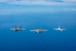 U.S. Air Force F-22 Raptors assigned to the 199th Expeditionary Fighter Squadron conducts a bilateral training mission alongside a Philippine Air Force FA-50 during exercise Cope Thunder 23-2 over the South China Sea, July 10, 2023. Through bilateral training, the U.S. and Philippine Air Forces work together to promote interoperability, thus furthering our investments and strengthening our relationships. (U.S. Air National Guard photo by Master Sgt. Mysti Bicoy)