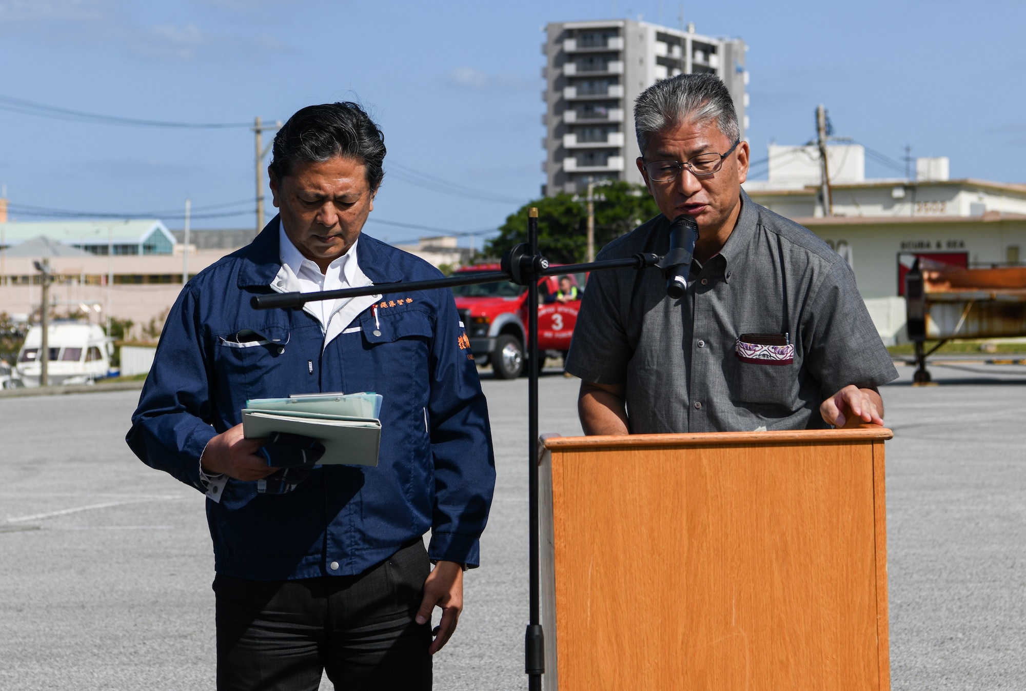 Teruhiko Moriwaki, right, Director for Crisis Management in Okinawa, gives opening remarks.