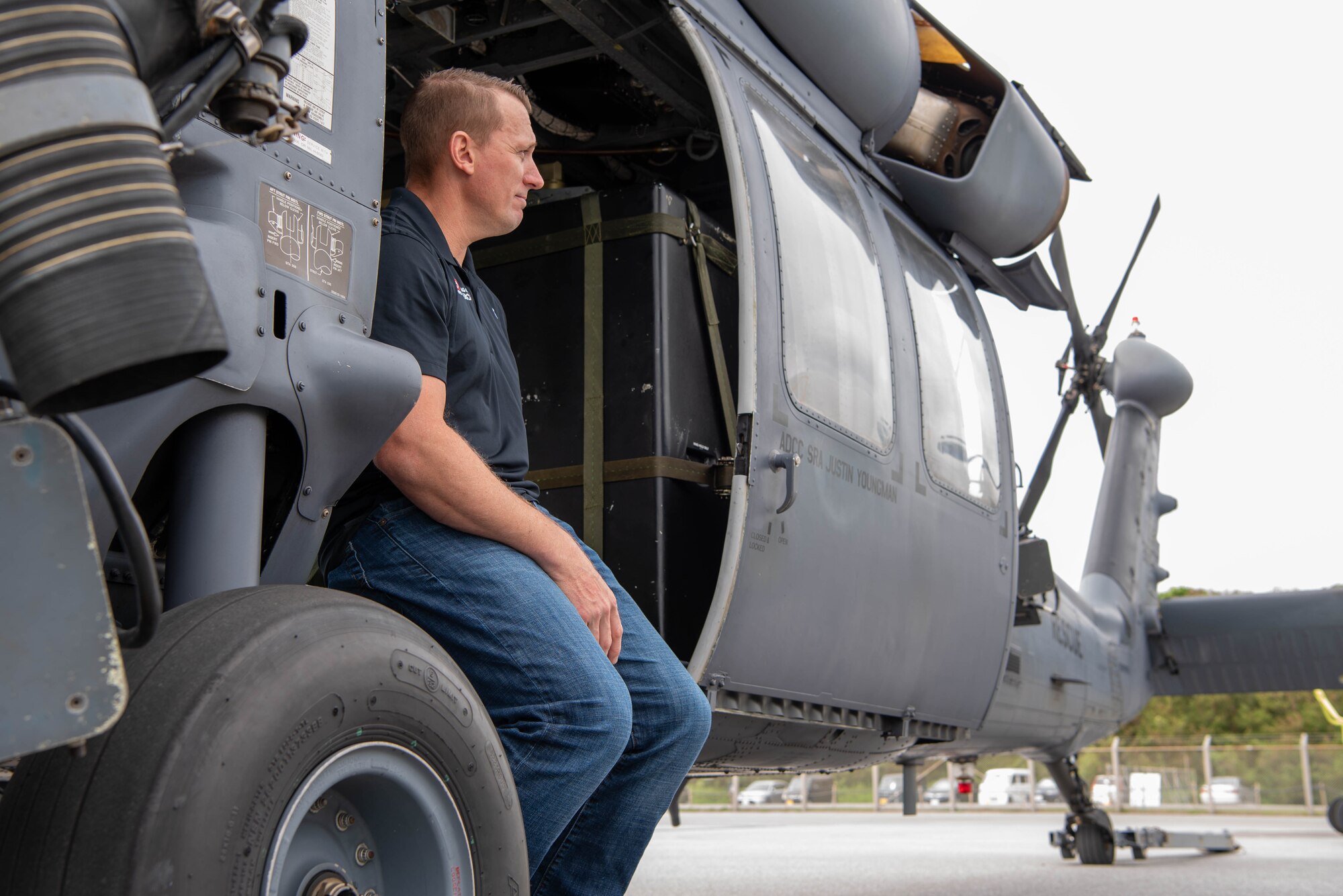 man sits in helicopter