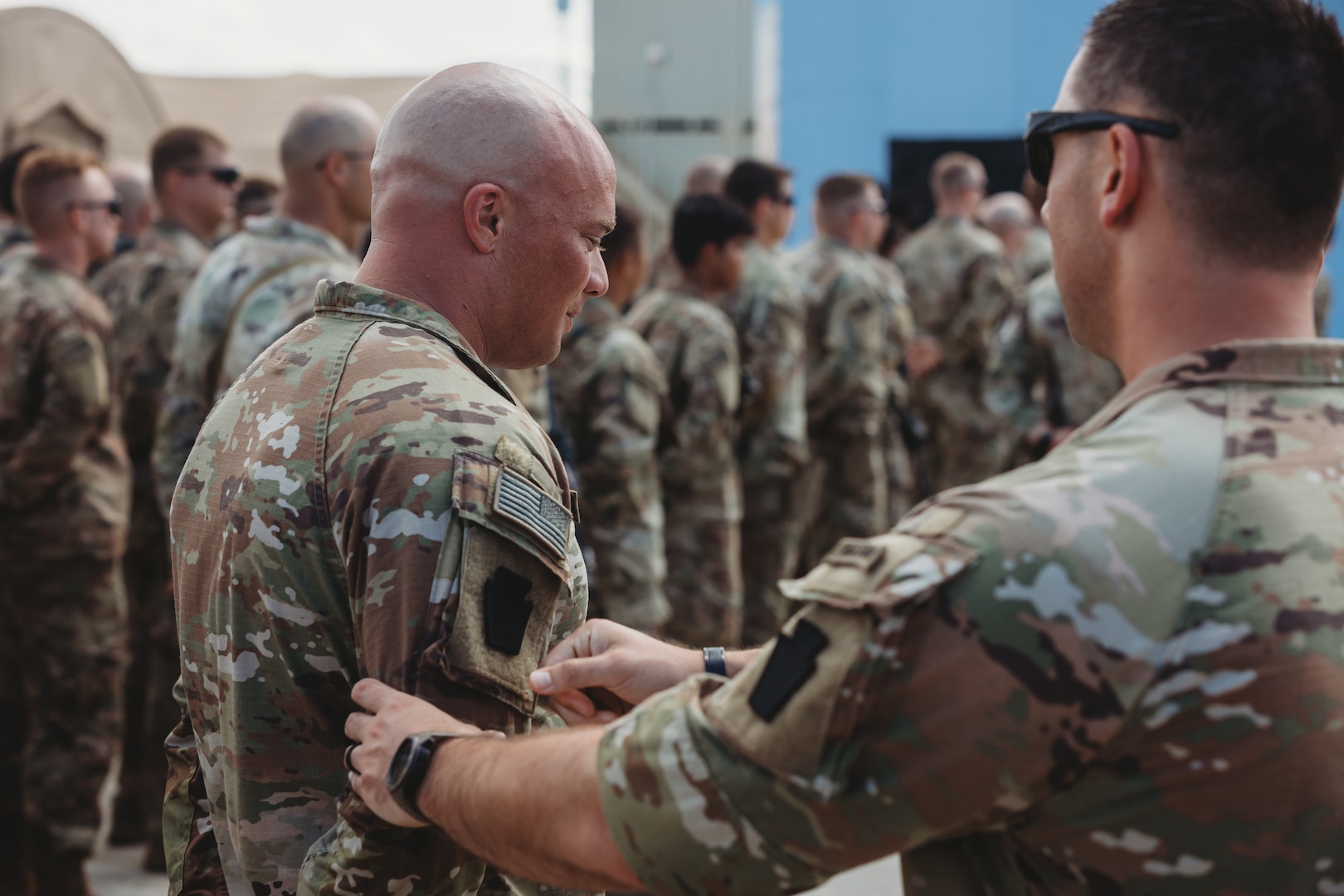 U.S. Soldiers with the 56th Stryker Brigade Combat Team, 28th Infantry Division, deployed as Task Force Paxton, receive their combat patches during a ceremony at Camp Simba, Kenya, March 21, 2024. Officially called the Shoulder Sleeve Insignia-Military Operations in Hostile Conditions, eligible Soldiers are able to wear that insignia on their right shoulder for the rest of their Army career.