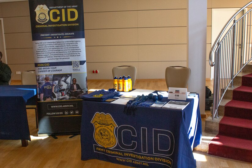 An Army CID recruiting booth at an On-Base Job Fair in Baumholder, Germany