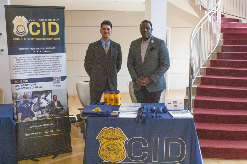 Two Special Agents stand at a table