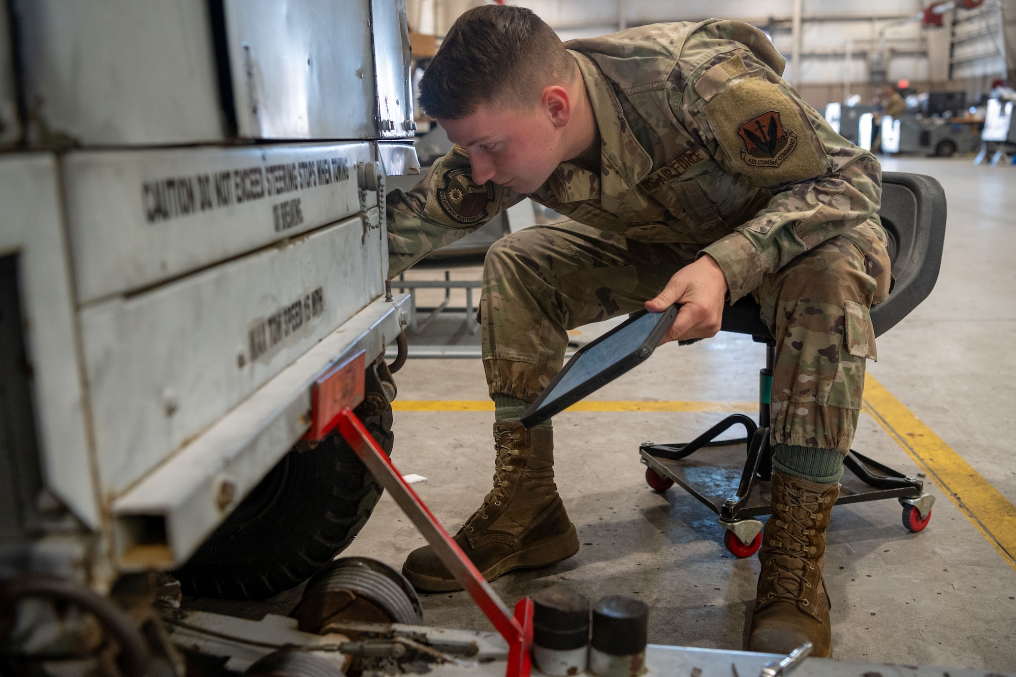 U.S. Air Force Senior Airman Gavin Wainwright, 20th Equipment Maintenance Squadron aerospace ground equipment technician, follows a technical order to repair hardware at Shaw Air Force Base, S.C., March 12, 2024. AGE Airmen use TOs to repair hardware with 100% accuracy, this enables them to deliver serviceable equipment to the flightline which allows aircraft maintainers to resolve any aircraft issues. (U.S. Air Force photo by Airman 1st Class Kyrii Richardson)