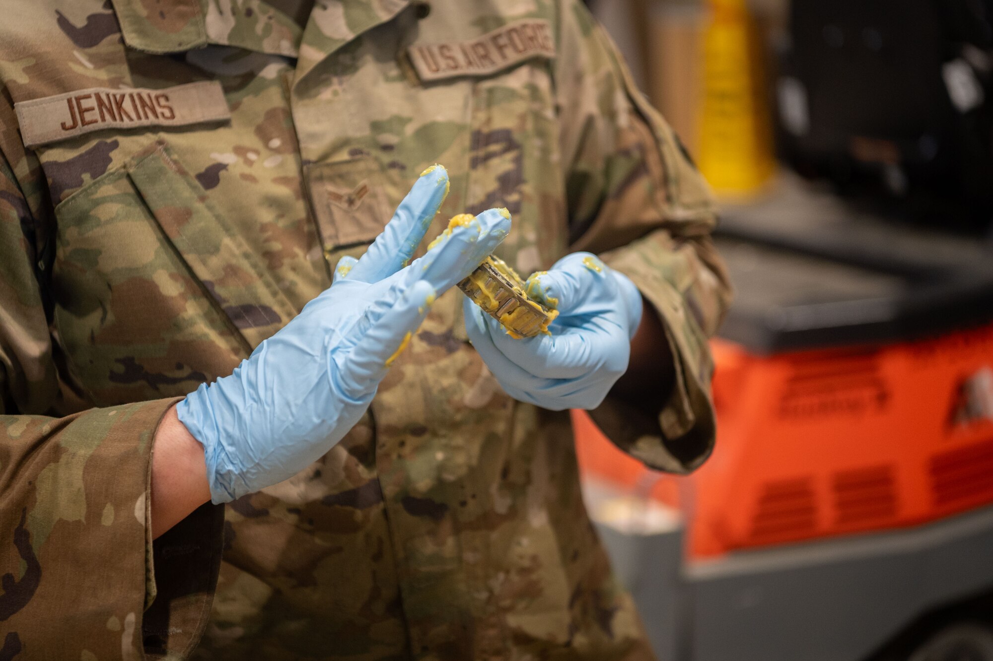 U.S. Air Force Airman 1st Class Brian Jenkins, 20th Equipment Maintenance Squadron aerospace ground equipment technician, lubricates a wheel bearing at Shaw Air Force Base, S.C., March 12, 2024. The routine preventative maintenance that AGE Airmen perform reduces the necessity of more in-depth maintenance, enabling airpower around the clock. (U.S. Air Force photo by Airman 1st Class Kyrii Richardson)