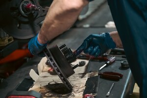 Ara Rinderle, Langley Auto Skills Center automotive technician, lubricates a wheel bearing at Joint Base Langley-Eustis, Virginia, Mar. 1, 2024. Greasing a wheel bearing is essential to ensure efficient operation and prolonging their lifespan, while maintaining good braking performance.  (U.S. Air Force photo by Airman 1st Class Adisen Smith)