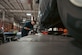 Ara Rinderle, Langley Auto Skills Center automotive technician, hammers a wheel stud at Joint Base Langley-Eustis, Virginia, Mar. 1, 2024. Langley Auto Skills Center mechanics offer many services such as tire changes, state inspections, braking system repairs and oil changes to help Airmen keep their vehicles maintained. (U.S. Air Force photo by Airman 1st Class Adisen Smith)