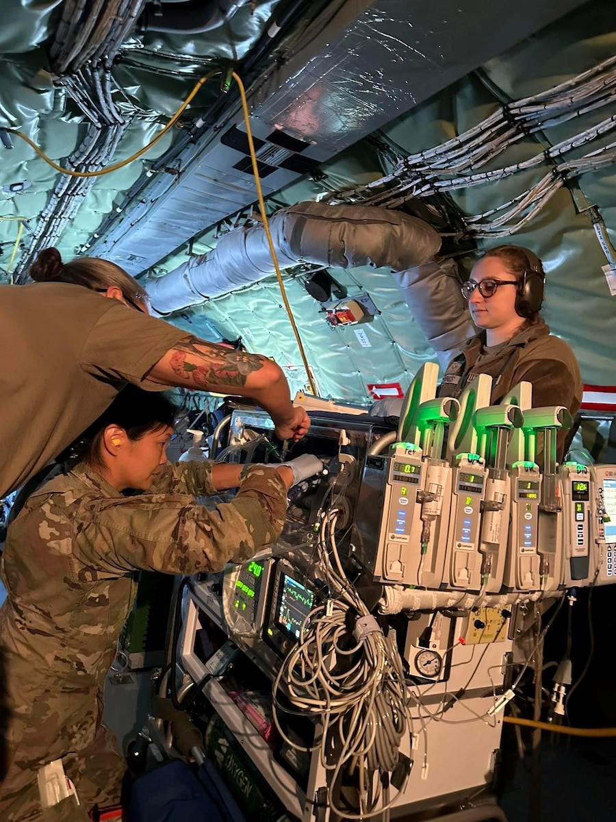 Airmen take care of a infant inside of a plane