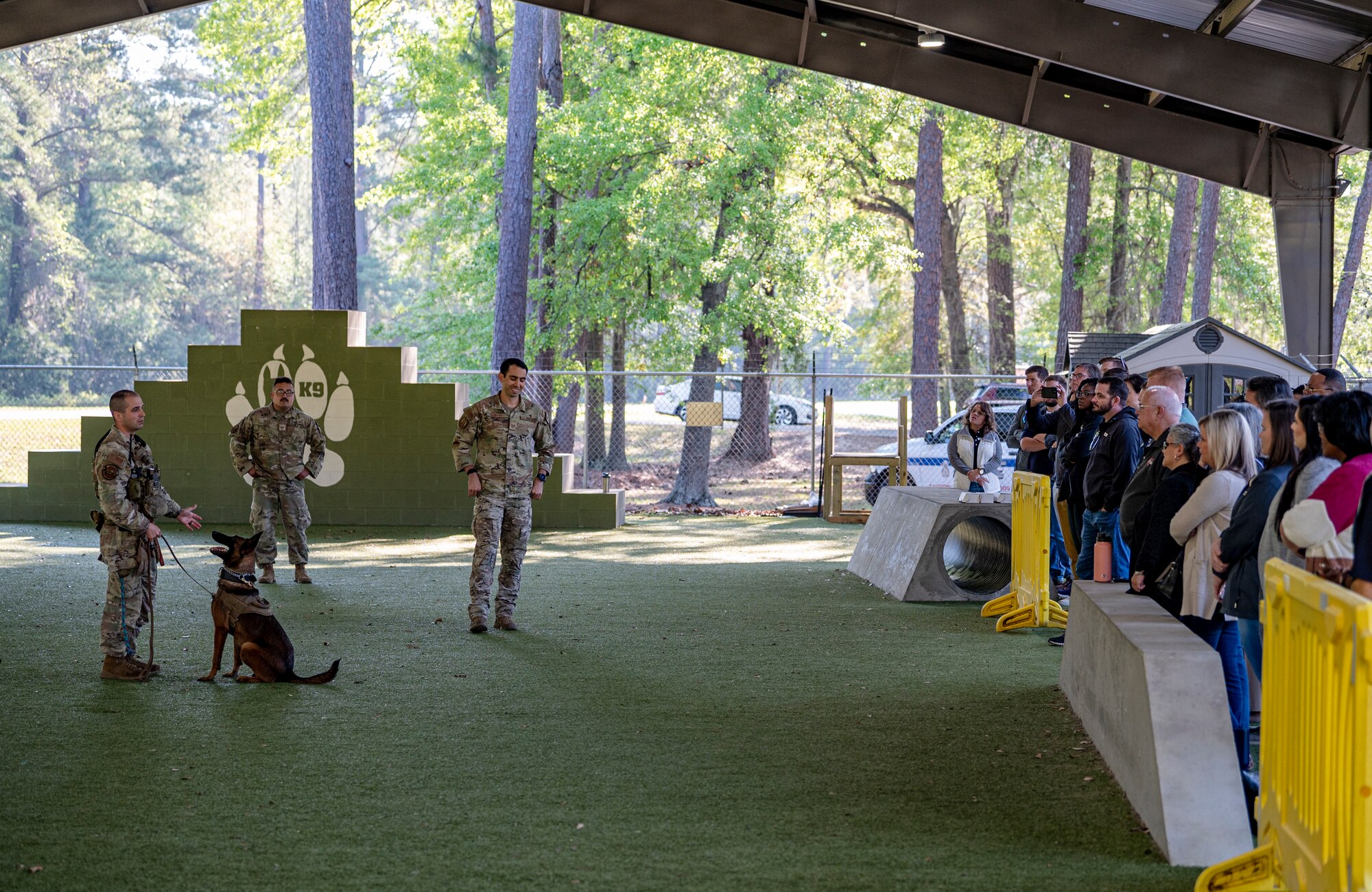 U.S. Air Force Airmen assigned to the 23rd Security Forces Squadron explain the military working dog program to Leadership Lowndes class of 2024 at Moody Air Force Base, Georgia, March 21, 2024. The MWD team briefed the leaders on their mission and how they employ their working dogs in real-world scenarios. (U.S. Air Force photo by Airman 1st Class Leonid Soubbotine)