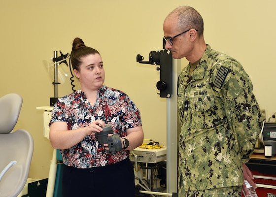 JOINT BASE SAN ANTONIO-FORT SAM HOUSTON – (March 25, 2024) – Dr. Meaghan Rose, a research scientist assigned to Naval Medical Research Unit (NAMRU) San Antonio’s Craniofacial Health and Restorative Medicine Directorate, presents an in-house design of an amalgam separator for dental chairs to Rear Adm. Guido Valdes, commander, Naval Medical Forces Pacific (NMFP), during Valdes’ official visit at the Battlefield Health and Trauma Research Institute. Valdes, who serves as the Chief of Navy Medical Corps, has oversight of 10 Navy Medicine Readiness and Training Commands on the West Coast and Pacific Rim as well as Navy Medicine's eight global research labs. Valdes also serves under the Defense Health Agency (DHA) as the director of the Defense Health Network Pacific Rim where he oversees the delivery and integration of healthcare at nine medical treatment facilities (MTF) on the West Coast and Pacific Rim. NAMRU San Antonio’s mission is to conduct gap driven combat casualty care, craniofacial, and directed energy research to improve survival, operational readiness, and safety of Department of Defense (DoD) personnel engaged in routine and expeditionary operations. It is one of the leading research and development laboratories for the U.S. Navy under the DoD and is one of eight subordinate research commands in the global network of laboratories operating under the Naval Medical Research Command in Silver Spring, Md. (U.S. Navy photo by Burrell Parmer, NAMRU San Antonio Public Affairs/Released)