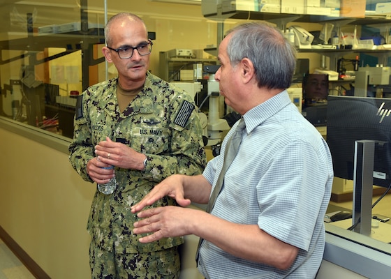 JOINT BASE SAN ANTONIO-FORT SAM HOUSTON – (March 25, 2024) – Dr. Amer Tiba, a research scientist assigned to Naval Medical Research Unit (NAMRU) San Antonio’s Craniofacial Health and Restorative Medicine Directorate, briefs research on self-healing dental resin versus a flowable restorative to Rear Adm. Guido Valdes, commander, Naval Medical Forces Pacific (NMFP), during Valdes’ official visit at the Battlefield Health and Trauma Research Institute. Valdes, who serves as the Chief of Navy Medical Corps, has oversight of 10 Navy Medicine Readiness and Training Commands on the West Coast and Pacific Rim as well as Navy Medicine's eight global research labs. Valdes also serves under the Defense Health Agency (DHA) as the director of the Defense Health Network Pacific Rim where he oversees the delivery and integration of healthcare at nine medical treatment facilities (MTF) on the West Coast and Pacific Rim. NAMRU San Antonio’s mission is to conduct gap driven combat casualty care, craniofacial, and directed energy research to improve survival, operational readiness, and safety of Department of Defense (DoD) personnel engaged in routine and expeditionary operations. It is one of the leading research and development laboratories for the U.S. Navy under the DoD and is one of eight subordinate research commands in the global network of laboratories operating under the Naval Medical Research Command in Silver Spring, Md. (U.S. Navy photo by Burrell Parmer, NAMRU San Antonio Public Affairs/Released)