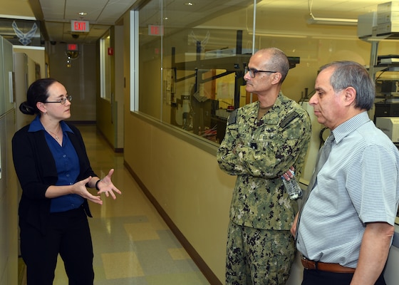 JOINT BASE SAN ANTONIO-FORT SAM HOUSTON – (March 25, 2024) – Dr. Sabrina Snyder, a research scientist, joined by fellow research scientist Dr. Amer Tiba, both assigned to Naval Medical Research Unit (NAMRU) San Antonio’s Craniofacial Health and Restorative Medicine Directorate, briefs research on self-healing dental resin versus a flowable restorative to Rear Adm. Guido Valdes, commander, Naval Medical Forces Pacific (NMFP), during Valdes’ official visit at the Battlefield Health and Trauma Research Institute. Valdes, who serves as the Chief of Navy Medical Corps, has oversight of 10 Navy Medicine Readiness and Training Commands on the West Coast and Pacific Rim as well as Navy Medicine's eight global research labs. Valdes also serves under the Defense Health Agency (DHA) as the director of the Defense Health Network Pacific Rim where he oversees the delivery and integration of healthcare at nine medical treatment facilities (MTF) on the West Coast and Pacific Rim. NAMRU San Antonio’s mission is to conduct gap driven combat casualty care, craniofacial, and directed energy research to improve survival, operational readiness, and safety of Department of Defense (DoD) personnel engaged in routine and expeditionary operations. It is one of the leading research and development laboratories for the U.S. Navy under the DoD and is one of eight subordinate research commands in the global network of laboratories operating under the Naval Medical Research Command in Silver Spring, Md. (U.S. Navy photo by Burrell Parmer, NAMRU San Antonio Public Affairs/Released)