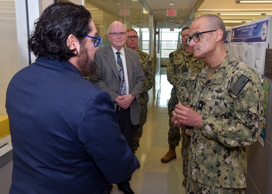 JOINT BASE SAN ANTONIO-FORT SAM HOUSTON – (March 25, 2024) – Dr. Luis Martinez, a research microbiologist assigned to Naval Medical Research Unit (NAMRU) San Antonio’s Craniofacial Health and Restorative Medicine Directorate, briefs research on Electrospun Alveolar Ridge Grafts to Rear Adm. Guido Valdes, commander, Naval Medical Forces Pacific (NMFP), during Valdes’ official visit at the Battlefield Health and Trauma Research Institute. Valdes, who serves as the Chief of Navy Medical Corps, has oversight of 10 Navy Medicine Readiness and Training Commands on the West Coast and Pacific Rim as well as Navy Medicine's eight global research labs. Valdes also serves under the Defense Health Agency (DHA) as the director of the Defense Health Network Pacific Rim where he oversees the delivery and integration of healthcare at nine medical treatment facilities (MTF) on the West Coast and Pacific Rim. NAMRU San Antonio’s mission is to conduct gap driven combat casualty care, craniofacial, and directed energy research to improve survival, operational readiness, and safety of Department of Defense (DoD) personnel engaged in routine and expeditionary operations. It is one of the leading research and development laboratories for the U.S. Navy under the DoD and is one of eight subordinate research commands in the global network of laboratories operating under the Naval Medical Research Command in Silver Spring, Md. (U.S. Navy photo by Burrell Parmer, NAMRU San Antonio Public Affairs/Released)