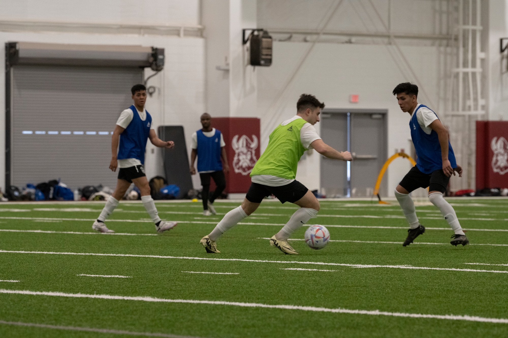 A photo of people playing soccer.