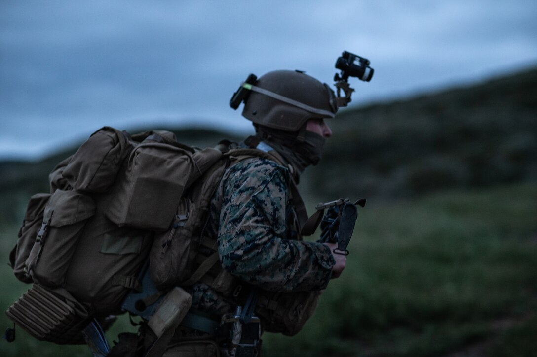 U.S. Marine Cpl. Julio Leyva a joint fires observer assigned to 1st Air Naval Gunfire Liaison Company, I Marine Expeditionary Force Information Group, I Marine Expeditionary Force, participate in a foot patrol during a brigade platoon field exercise on Marine Corps Base Camp Pendleton, California, April 7, 2020.  The purpose of this exercise was for Marines to sustain and enhance basic warfighting skills such as land navigation, day and night patrolling, and long range communication capabilities. (U.S. Marine Corps photo by Sgt. Manuel A. Serrano)
