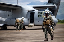 U.S. Marine Corps Capt. Logan Vaughan, a MV-22B Osprey pilot with Marine Medium Tilt-Rotor Squadron (VMM) 265, walks the flight line during Marine Aviation Support Activities 22-2, July 18, 2022, Subic Bay, Philippines.