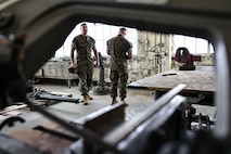 U.S. Marine Corps Gunnery Sgt. Derek M. Wolford, battery gunnery sergeant with India Battery, 3rd Battalion, 14th Marine Regiment, left, and Gunnery Sgt. Jeremy J. Toteno, battery gunnery sergeant with Golf Battery, 3rd Battalion, 14th Marine Regiment, conduct a mock inspection of hazard identification during the Ground Safety for Marines (GSM) Course on Marine Corps Base Camp Lejeune, North Carolina, April 24, 2023