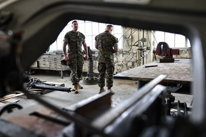 U.S. Marine Corps Gunnery Sgt. Derek M. Wolford, battery gunnery sergeant with India Battery, 3rd Battalion, 14th Marine Regiment, left, and Gunnery Sgt. Jeremy J. Toteno, battery gunnery sergeant with Golf Battery, 3rd Battalion, 14th Marine Regiment, conduct a mock inspection of hazard identification during the Ground Safety for Marines (GSM) Course on Marine Corps Base Camp Lejeune, North Carolina, April 24, 2023