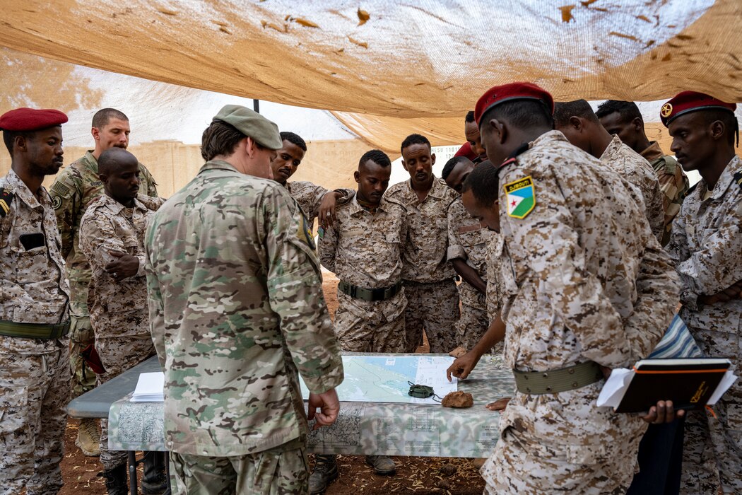 A U.S. Air Force member instructs Djiboutian soldiers.