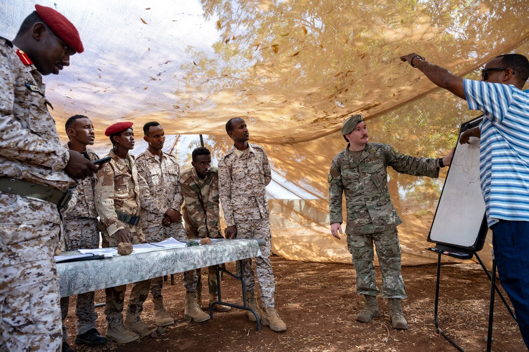 A U.S. Air Force member instructs Djiboutian soldiers.