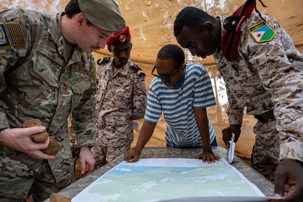 A U.S. Air Force member instructs Djiboutian soldiers.