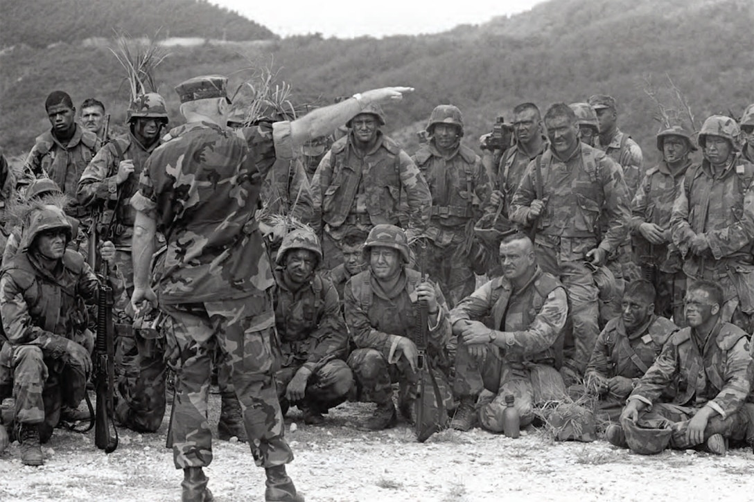 General Alfred M. Gray Jr., commandant of the Marine Corps, meets with U.S. Marines assigned to 2nd Battalion, 5th Marines following a live fire demonstration at Camp Hansen on Okinawa, Japan, Sept. 30, 1987.