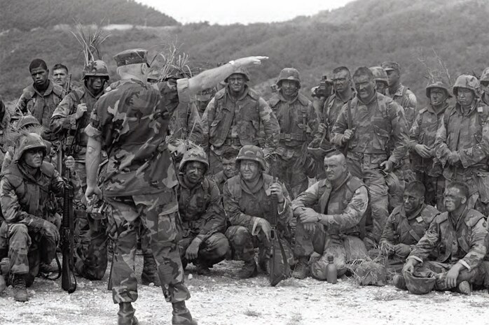 General Alfred M. Gray Jr., commandant of the Marine Corps, meets with U.S. Marines assigned to 2nd Battalion, 5th Marines following a live fire demonstration at Camp Hansen on Okinawa, Japan, Sept. 30, 1987.