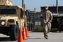 Lance Cpl. Patrick Donovan guides a Humvee during an Incidental Humvee Licensing Course at Marine Corps Air Station Cherry Point, N.C., Oct. 15, 2015. Marine Wing Support Squadron 274 Marines underwent an extensive course that covered basic operational skills, vehicle capabilities, emergency procedures and first echelon mechanics.