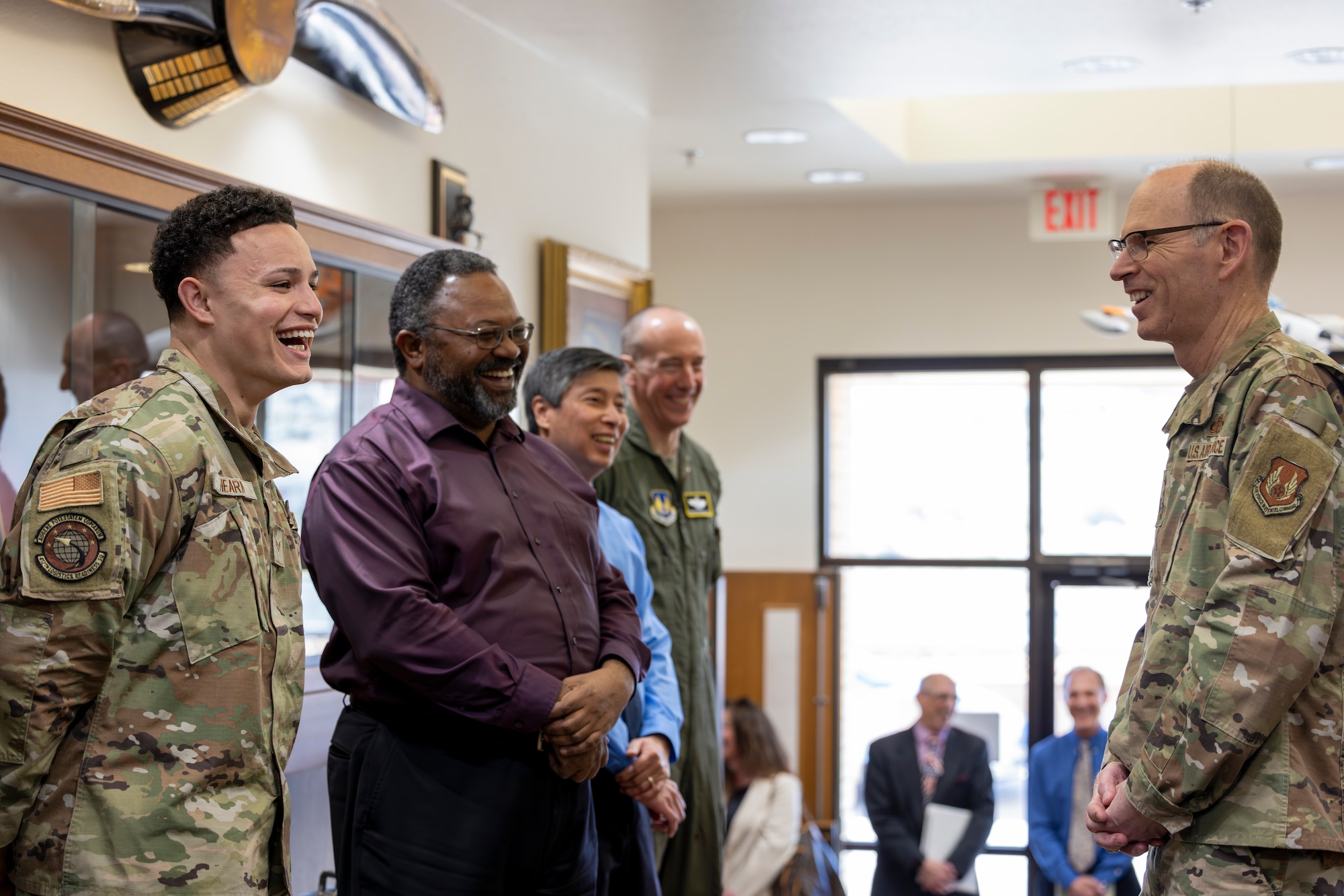 Senior Airman Boomer Hearn, 412th Logistics Readiness Squadron, shares a laugh with Gen. Duke Z. Richardson, commander, Air Force Materiel Command, during a visit to Edwards Air Force Base California, March 26. Richardson personally recognized Hearn and other top performers from across Edwards. (Air Force photo by Lindsey Iniguez)