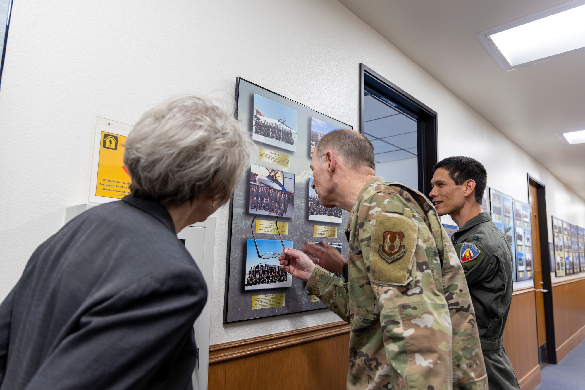 Gen. Duke Z. Richardson, commander, Air Force Materiel Command, and his wife Dede Richardson, learn about the history of the Air Force Test Pilot School from Col. James Valpiani, USAFTPS commandant, during a visit to Edwards Air Force Base California, March 26. (Air Force photo by Lindsey Iniguez)