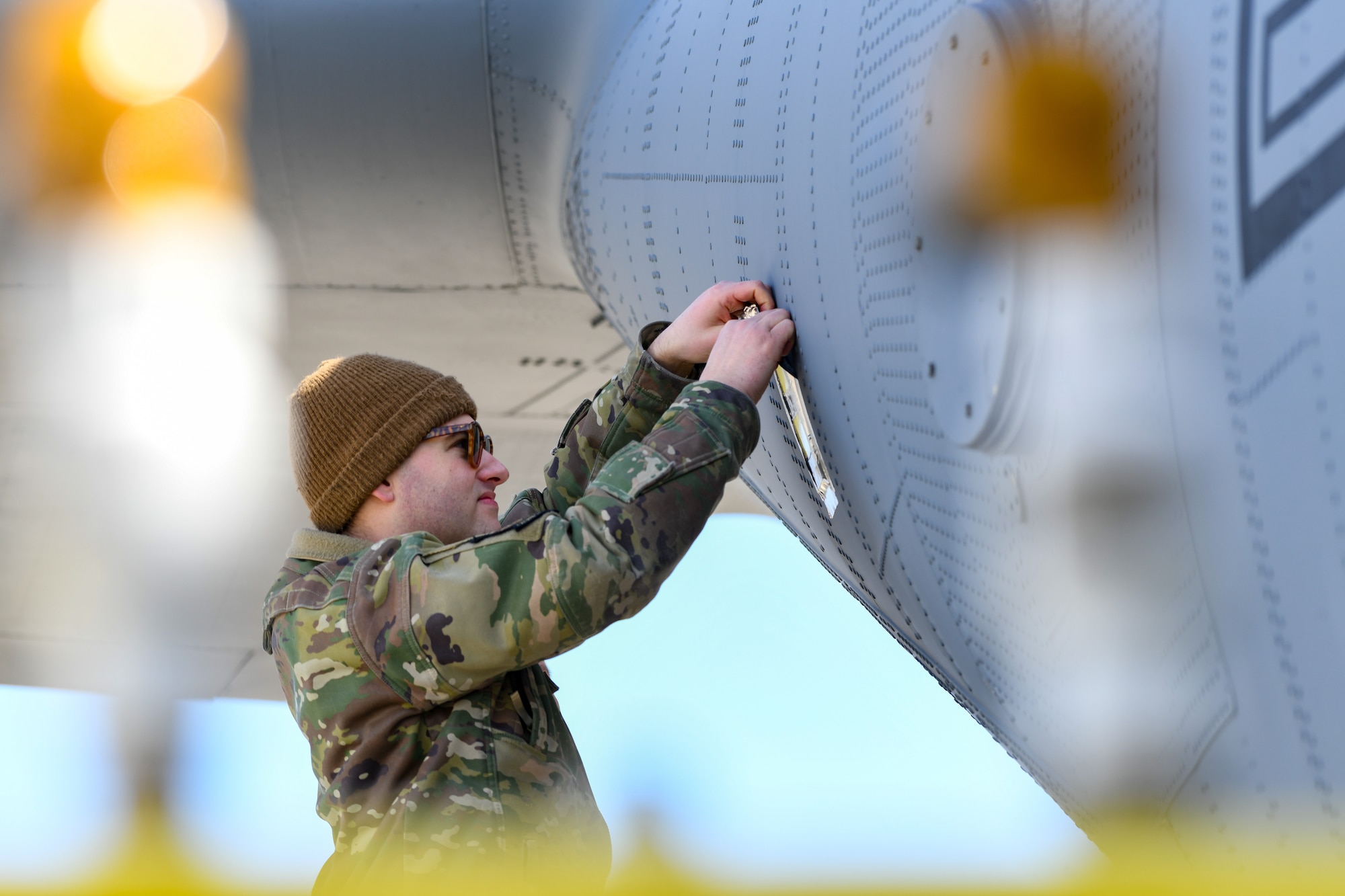 Staff Sgt. Zachery Wilson, an aerial spray system maintainer assigned to the 910th Maintenance Squadron, removes a droplet sample card from the tail of a C-130J-30 Super Hercules aircraft at Youngstown Air Reserve Station, Ohio, March 25, 2024.