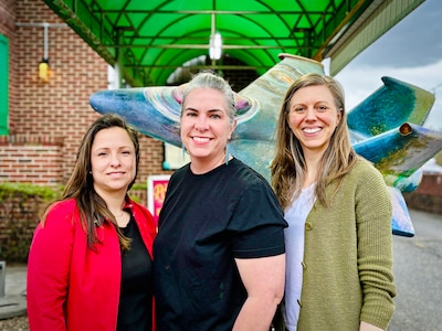 U.S. Air Force Lt. Col. Jen Warren, center, deputy director of AFWERX, stands with Air National Guard AFWERX fellowship recipients Lt. Col. Frances Romero, left, and Lt. Col. Cristi Campbell, right. Not pictured: U.S. Air Force Lt. Col. Autumn Lorenz.
